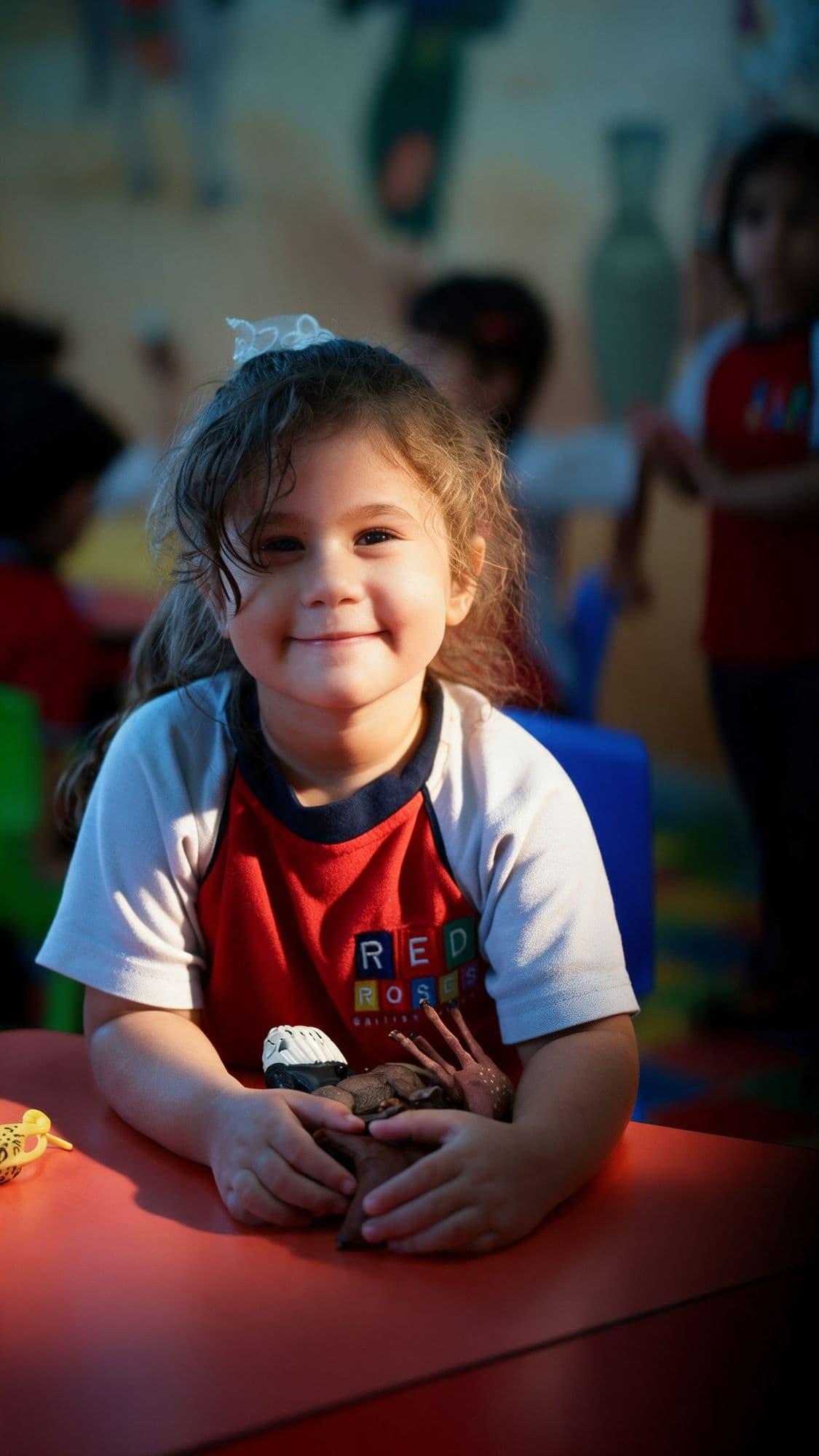 Smiling child in a Red Roses nursery classroom